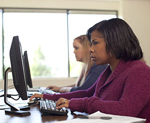 Adult Degree Program student on computer