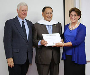 Dr. Cook (right) with Dr. Christensen and KAFU President, Dr. Mambetkaziyev