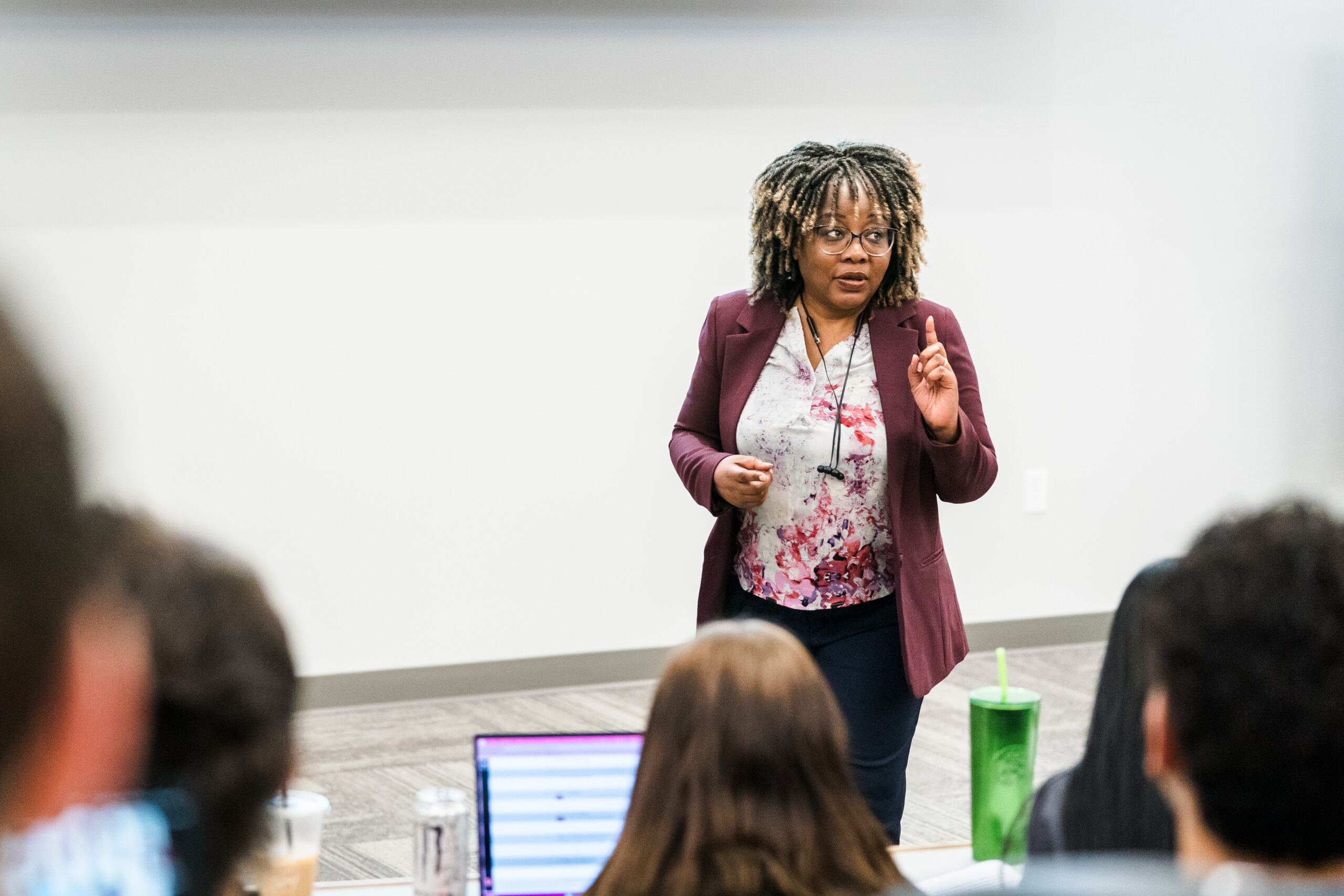 A WPU instructor speaking at the front of a classroom.