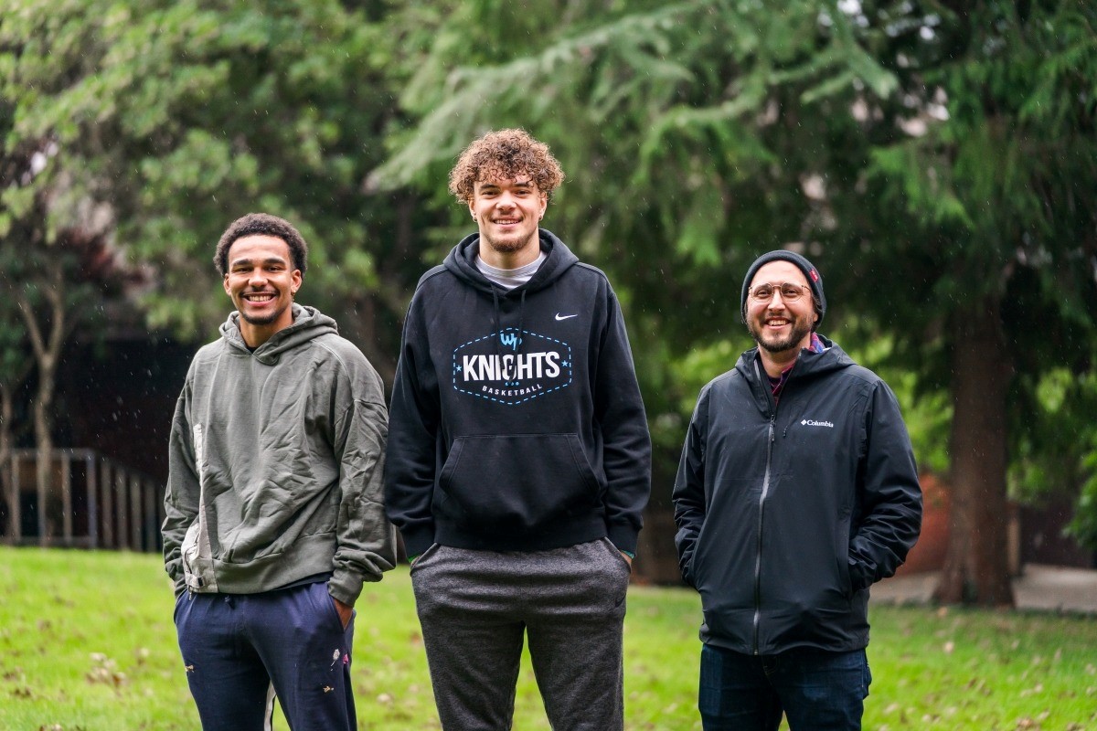 Three WPU students standing out in the A.F. Gray Lawn on campus.