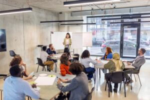 A training and development manager leads a training workshop.